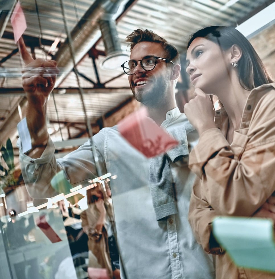 Businesspeople discussing notes-1